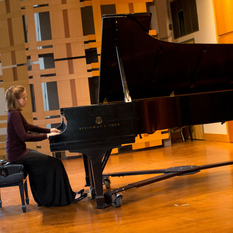 Female student playing piano
