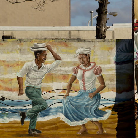 A mural of two people dancing 