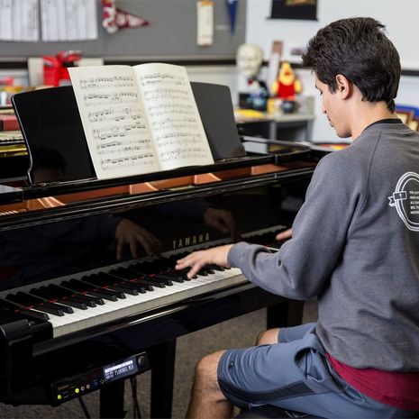 Temple student pianist practices on keyboard