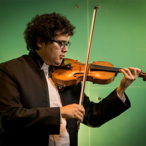 Temple student playing a violin solo