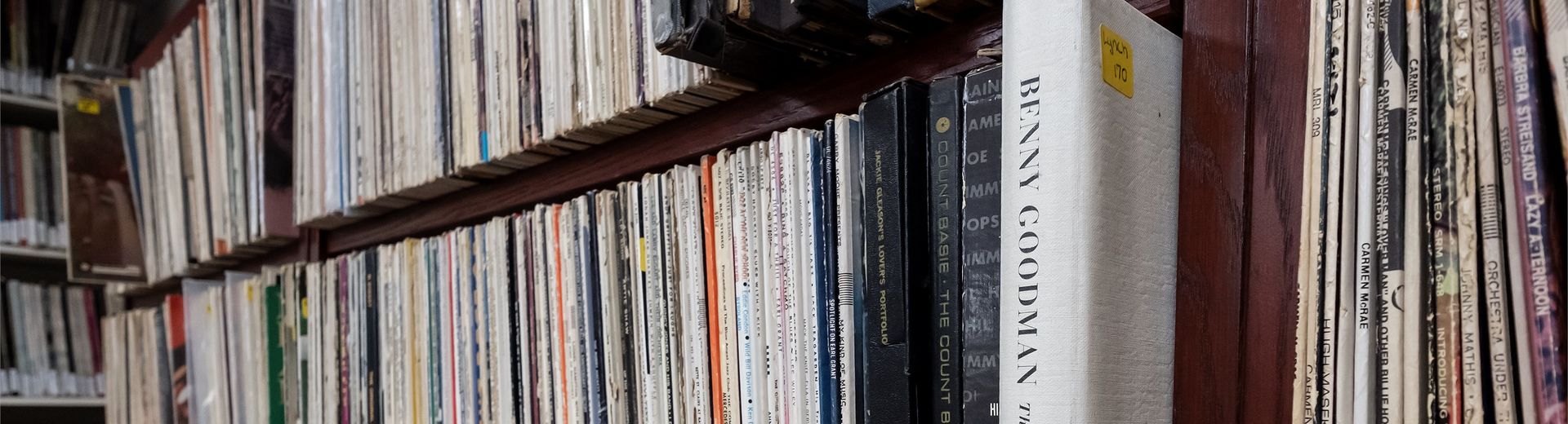 Bookshelf with multiple rows of music records