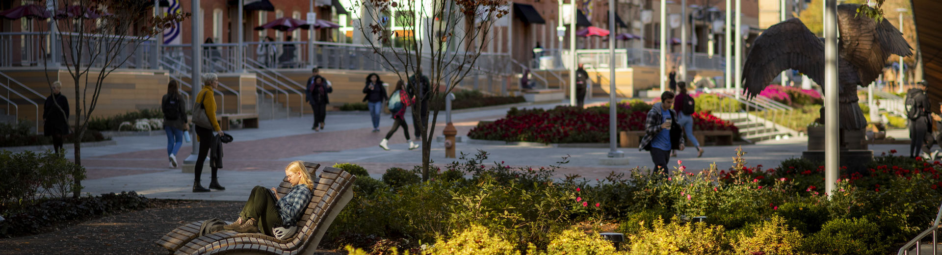 Students walking through O'Connor Plaza on a sunny fall day