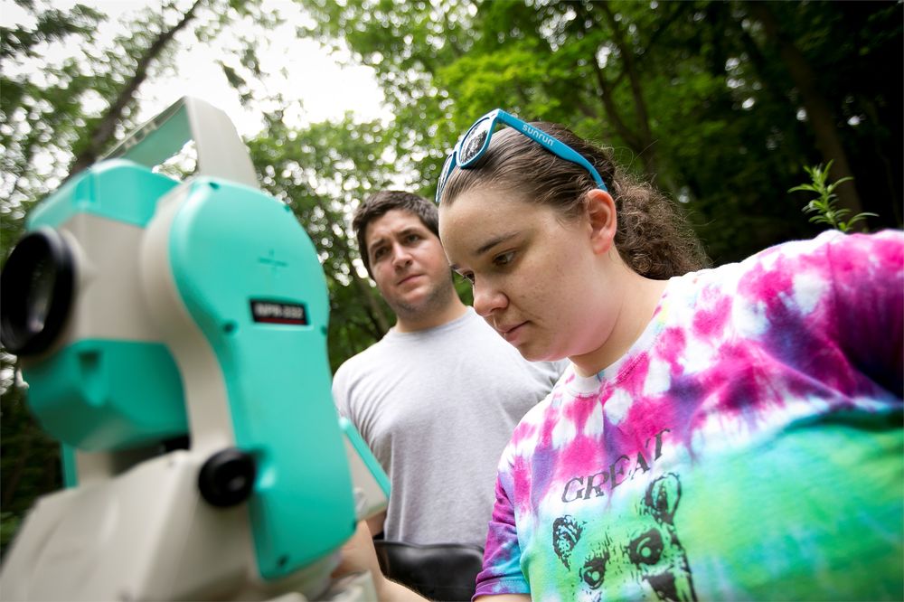 Geology students performing a study in the field