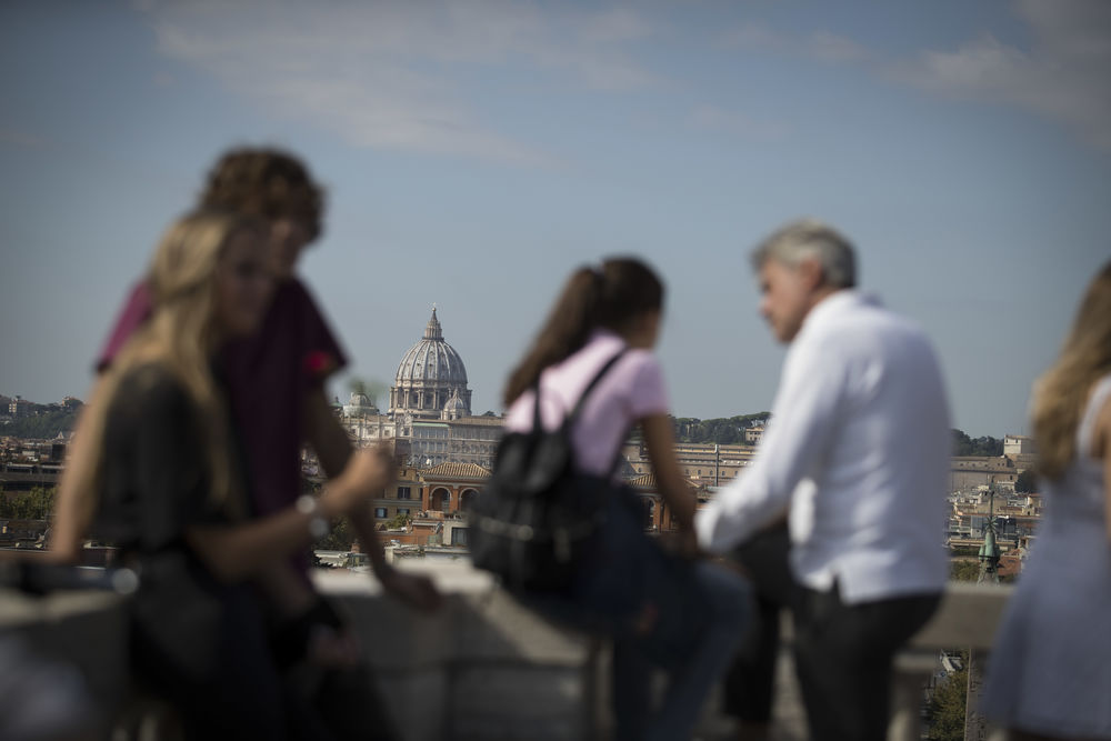 Tourists gather on a rooftop in Rome, Italy.
