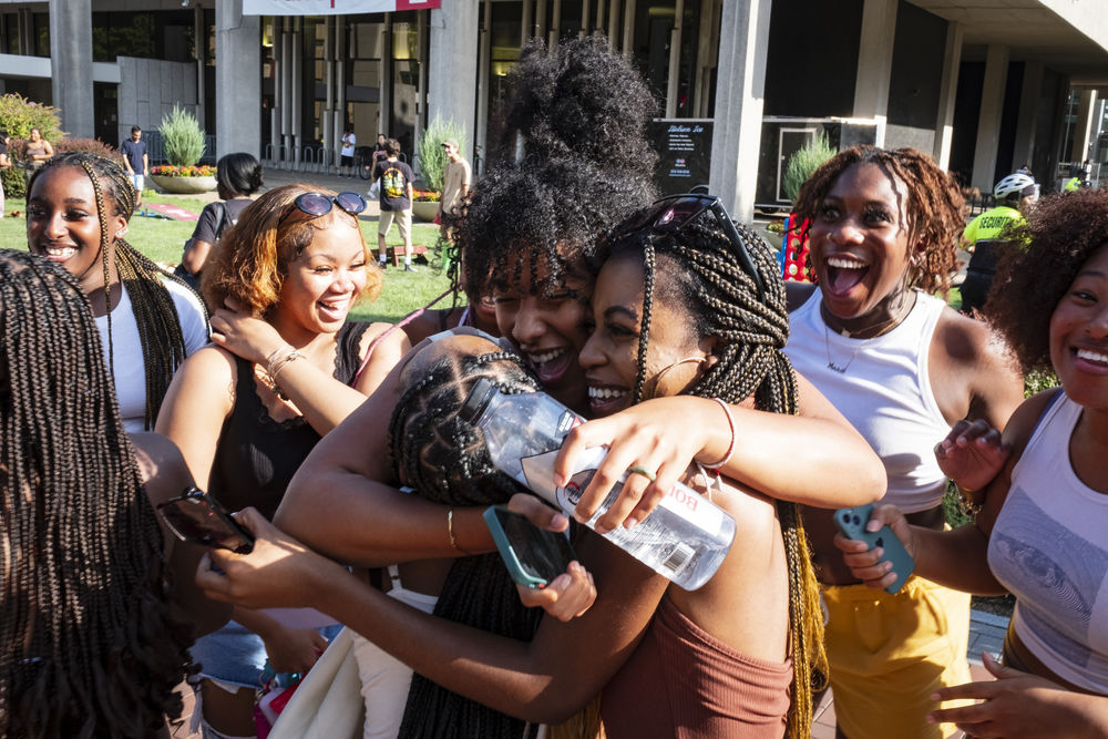 A group of students hugging each during Temple Fest.